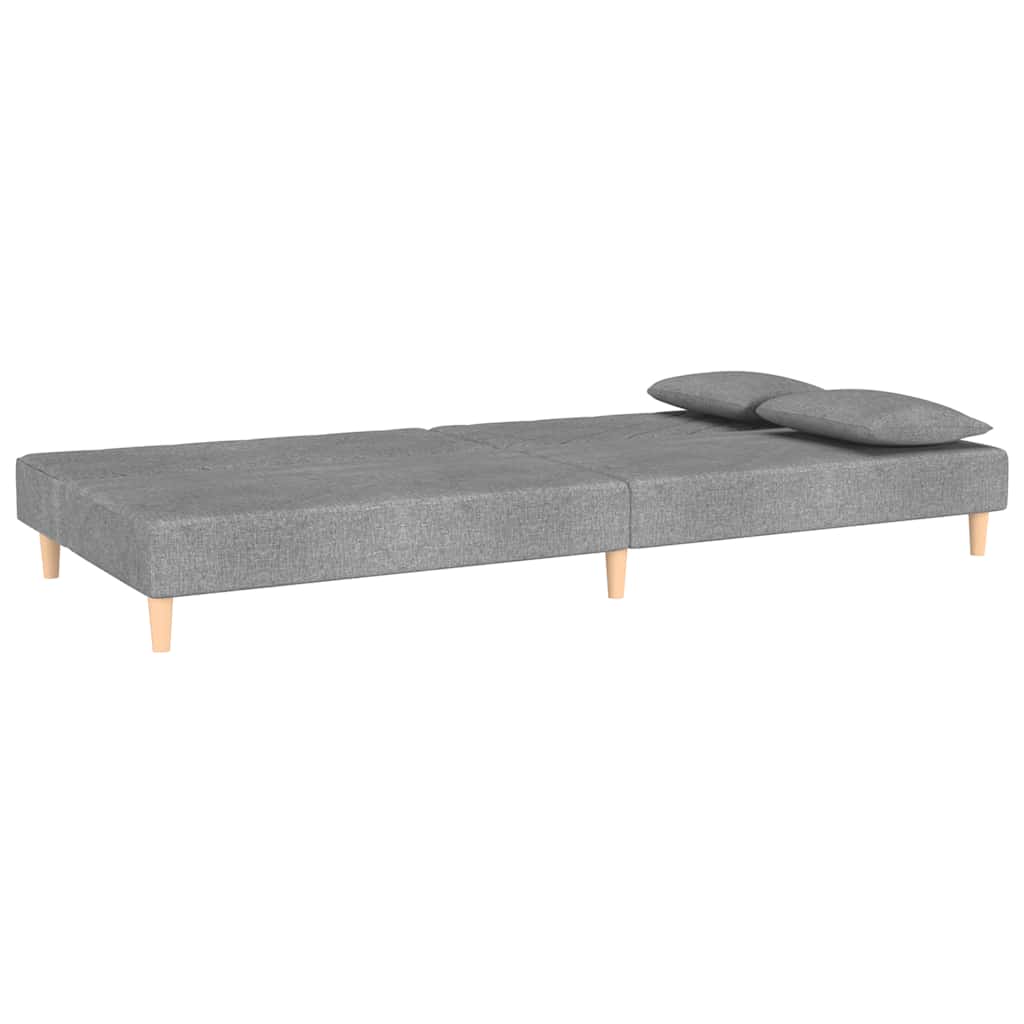 kétszemélyes világosszürke szövet kanapéágy két párnával
