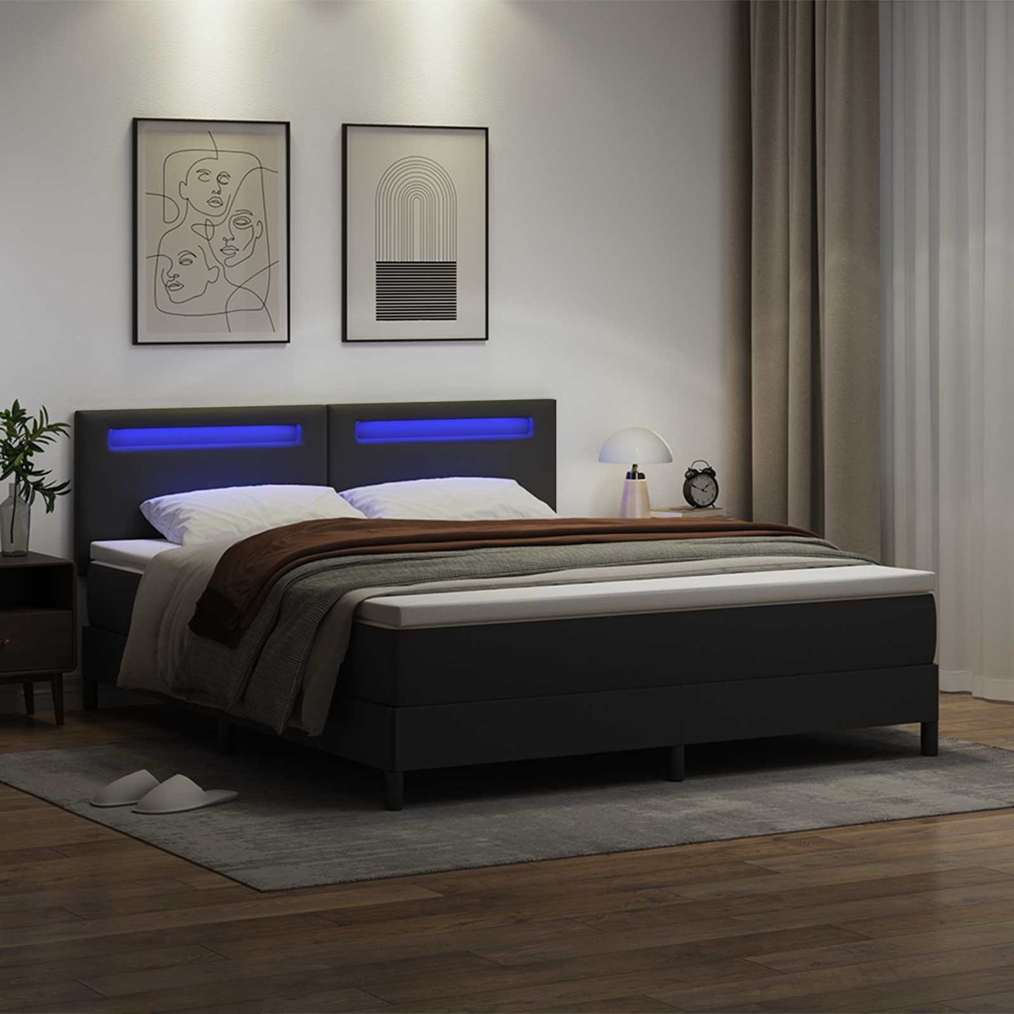 Boxrugós ágy LED szalagokkal Fekete 180 x 200 cm Műbőr
