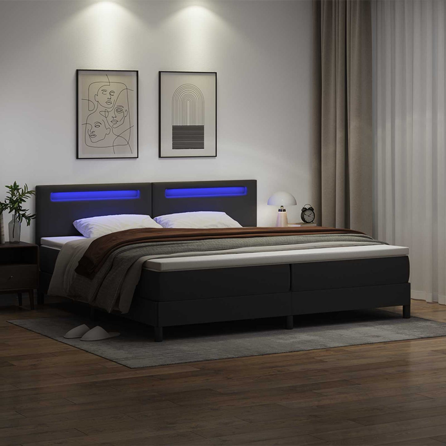 Boxrugós ágy matracmal leddel Fekete 200 x 200 cm Műbőr