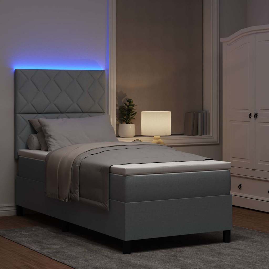 Boxrugós ágy LED szalagokkal Világosszürke 90 x 200 cm szövet